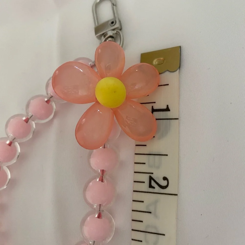 1-wrist lanyard for cells, keys and more Pink Oversized Flower Charm